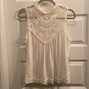 Embroidered laced sleeveless blouse